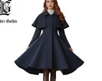 May include: A navy blue coat with a capelet and a flared skirt. The coat has long sleeves and a button-down front. The text "Leather Gothic" is visible in the upper left corner.