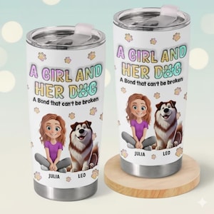 May include: Two white stainless steel tumblers with lids. Each tumbler features a cartoon illustration of a girl and a dog, with the text "A GIRL AND HER DOG" and "A Bond that can't be broken". The girl is wearing a purple shirt.