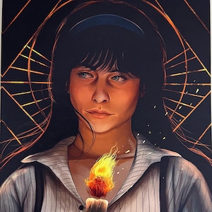 May include: Digital art print depicting a person with long black hair and a blue headband, holding a lit candle. The person is wearing a striped shirt with suspenders. The background features a geometric design in gold and black.