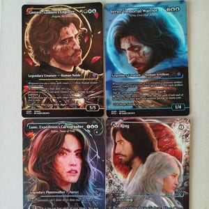 May include: Four rectangular trading cards featuring fantasy character illustrations. Top left: Gustave, Lumière's Engineer. Top right: Verso, Immortal Warrior. Bottom left: Lune, Expedition's Cartographer. Bottom right: Sol Ring. Each card displays text, symbols, and stats.