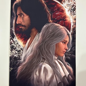 May include: A print depicting a man and a woman with long hair, set against a red planet background. The man has a tear on his face. The woman has long, flowing white hair and a tear rolling down her cheek.