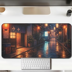 May include: A rectangular desk mat featuring a digital illustration of a Japanese street scene at night. The scene includes traditional buildings, glowing lanterns, and a wet, reflective street. The mat is designed to protect the desk surface.