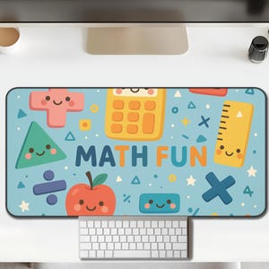May include: A rectangular desk mat with a light blue background featuring cartoon math symbols and the words "MATH FUN". The design includes a calculator, ruler, apple, and geometric shapes. A keyboard and mouse are visible.