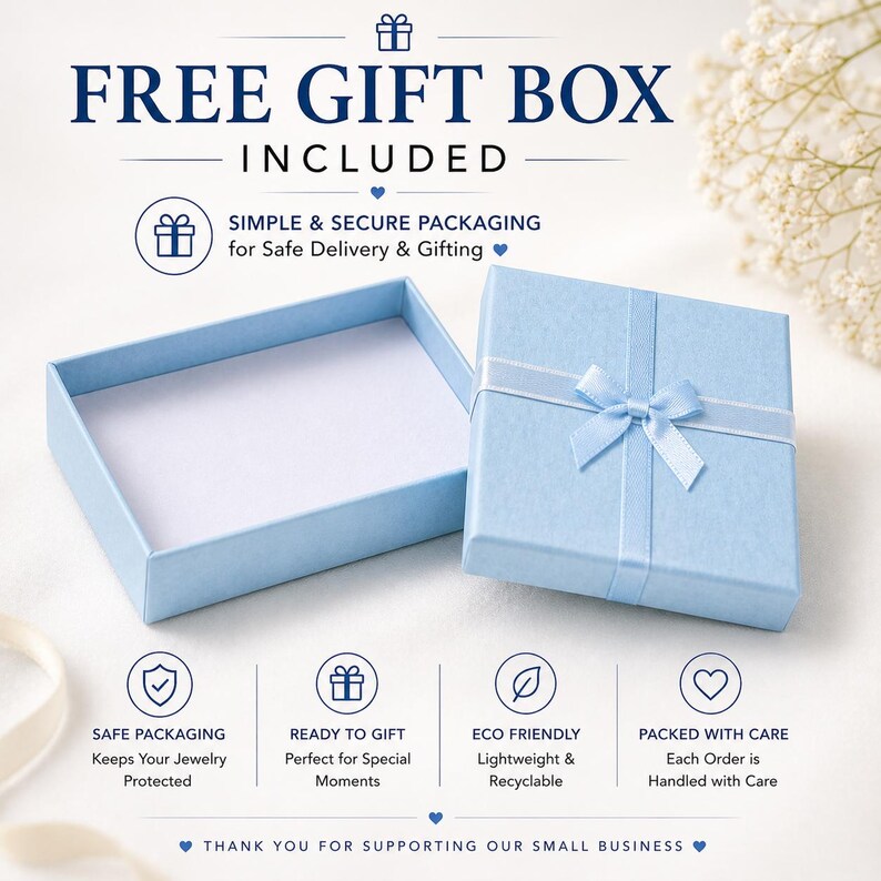 Puede incluir: Una caja de regalo azul claro con una cinta y lazo a juego, junto a una caja abierta. El texto dice "FREE GIFT BOX INCLUDED" y "SIMPLE & SECURE PACKAGING for Safe Delivery & Gifting". Texto adicional destaca embalaje seguro, listo para regalar, ecol&oacute;gico y embalado con cuidado.