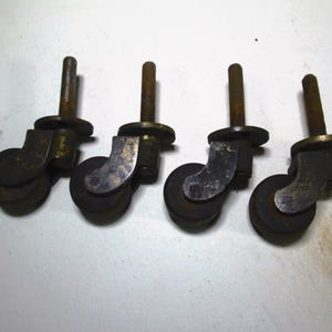 Set of Four Cast Brass Casters 1 3/16 inch Composition Wheel Victorian Antique Vintage Steampunk Industrial screw type M118