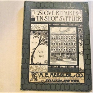 May include: An antique catalog titled "The Stove Repairer and Tin Shop Supplier" from 1919. The cover is dark green with decorative borders and text. The catalog features the company name, "A.E. Aessler Co." and the location, Syracuse, New York.