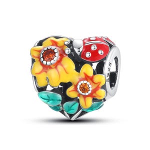 May include: A silver charm with a heart shape, featuring yellow flowers with orange centers, green leaves, and a red ladybug. The charm is detailed with black enamel and the text "S925".