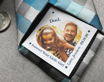 May include: A white card with a photo of a father and daughter. The card says "Dad, Forever Your Little Girl. Love, Jessica 09.19.26".