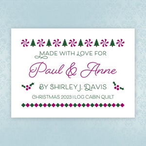 May include: A white gift tag with a green and red candy cane border, green Christmas trees, and holly. The tag reads "Made with love for Paul & Anne by Shirley J. Davis Christmas 2023 Log Cabin Quilt".