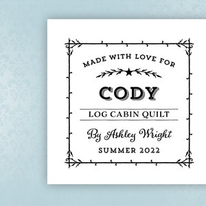 May include: A black and white printable label with a decorative border. The label reads "Made with love for Cody Log Cabin Quilt By Ashley Wright Summer 2022".