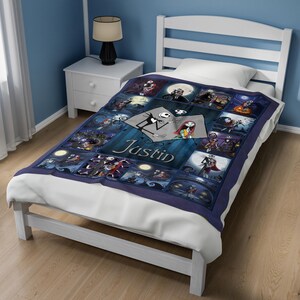 May include: A dark blue fleece blanket featuring a collage of scenes from The Nightmare Before Christmas, with the name Justin printed in white script across the center. The design includes various characters and moonlit settings in shades of blue.
