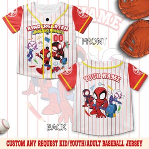 May include: A white baseball jersey with red pinstripes and red sleeves featuring Spidey and His Amazing Friends graphics. The front displays the text Kindergarten Amazing Friends and the back features the text Your Name with character illustrations.
