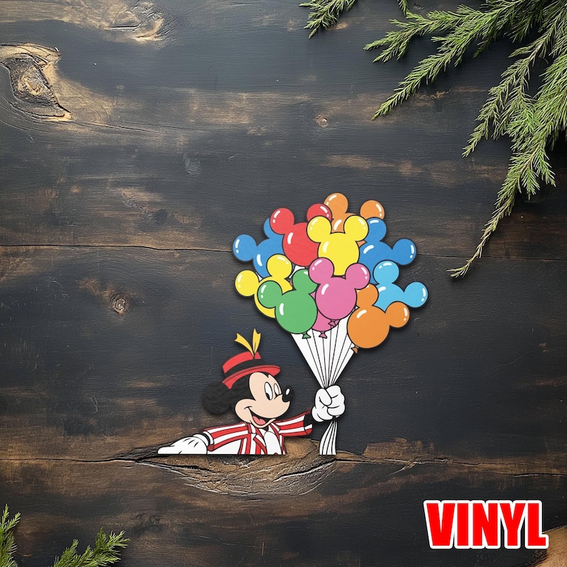 May include: A colorful vinyl sticker featuring Mickey Mouse holding a bouquet of Mickey Mouse-shaped balloons. The balloons are in various colors, including red, yellow, blue, green, pink, and orange. The word "VINYL" is in red letters.