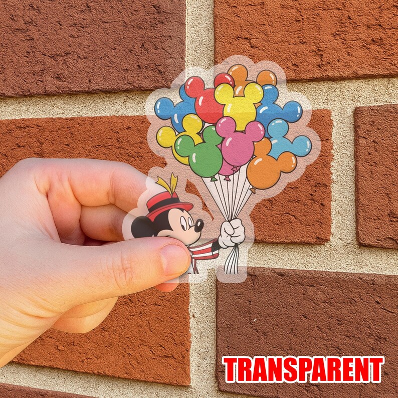 May include: Transparent sticker featuring Mickey Mouse holding a bouquet of Mickey Mouse-shaped balloons in various colors. Mickey is wearing a red and black hat and a red and white striped outfit. The word "TRANSPARENT" is printed in red.