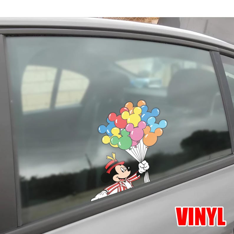 May include: A colorful vinyl decal featuring Mickey Mouse holding a bouquet of Mickey Mouse-shaped balloons. Mickey is dressed in a red and white striped outfit with a matching hat. The balloons are various colors, including red, yellow, blue, pink, and orange. The word "VINYL" is in red.