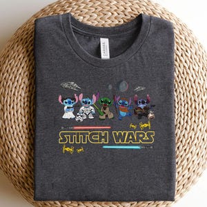 May include: A white ceramic mug with a black handle and the text "But First, Coffee" in a handwritten style. The mug is on a white surface. The mug is likely for hot beverages.