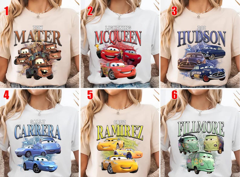 May include: Six t-shirts showcasing characters from the animated film "Cars." Each shirt has a different character's name in a retro font, accompanied by an image of the character. The shirts are in various colours, including white and beige.
