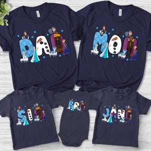 May include: Navy blue family t-shirts and a onesie featuring the word "Dad", "Mom", "Sis", "Bro", and "Jan" in a whimsical font. Each letter is decorated with characters from a popular animated movie.