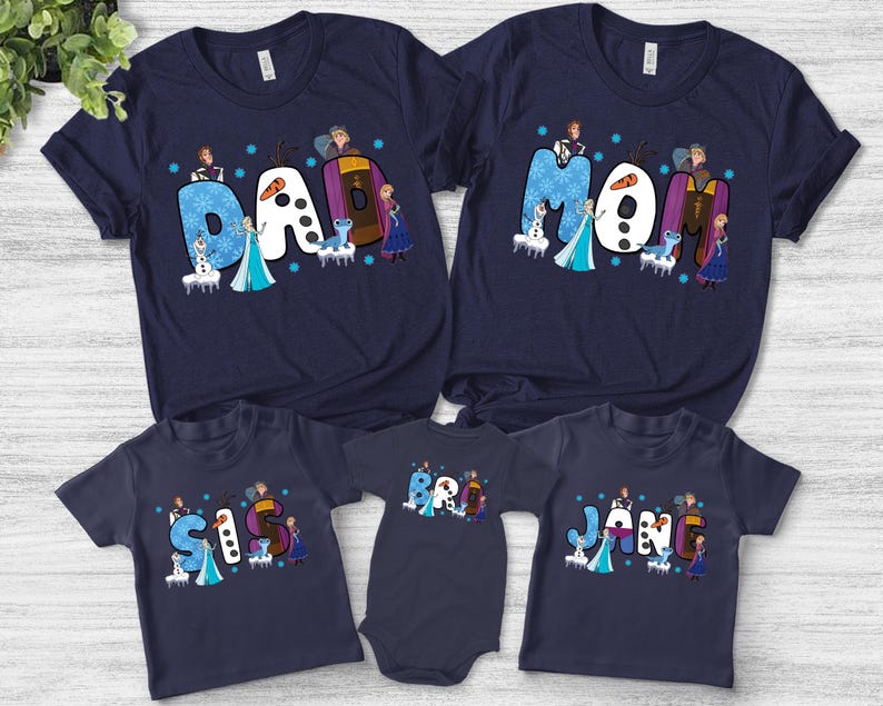 May include: Navy blue family t-shirts and a onesie featuring the word "Dad", "Mom", "Sis", "Bro", and "Jan" in a whimsical font. Each letter is decorated with characters from a popular animated movie.