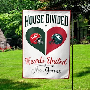 May include: A white garden flag with the text "HOUSE DIVIDED" above a heart split into green and red halves. Each half features a football helmet with the word "LOGO". Below, it reads "Hearts United The Greens".