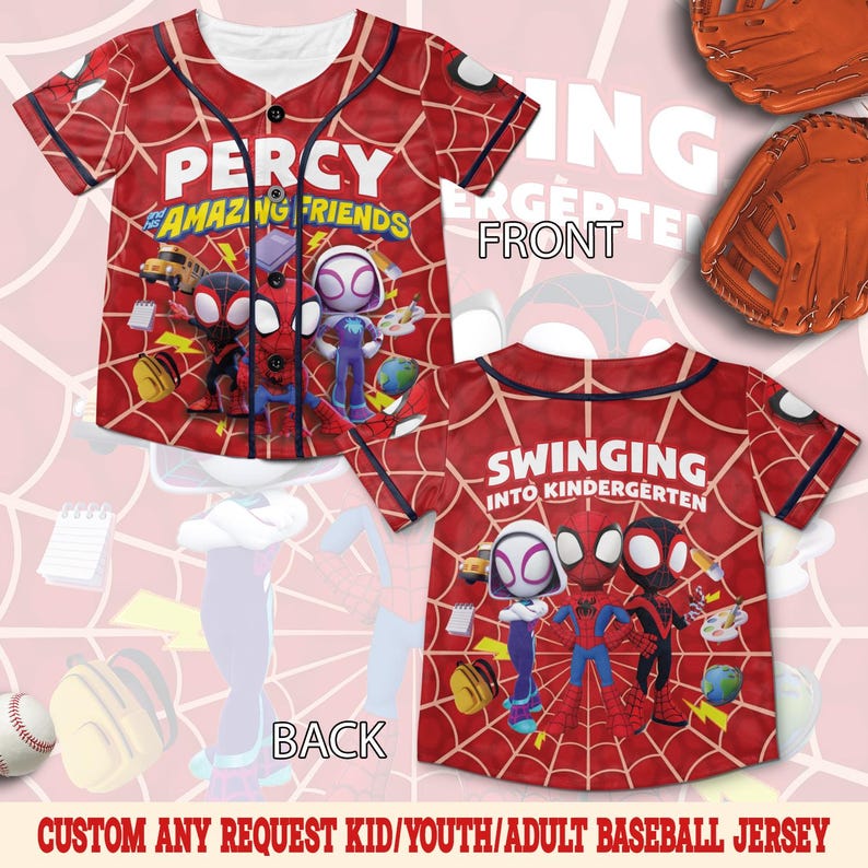 May include: A red baseball jersey with a spiderweb pattern, featuring the text PERCY AND HIS AMAZING FRIENDS on the front and SWINGING INTO KINDERGARTEN on the back. The design includes cartoon characters, school supplies, and black buttons.