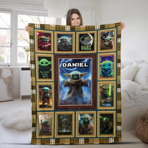 May include: A rectangular fleece blanket featuring a collage of Star Wars character images in gold-toned frames. The center panel displays a green creature with large ears surrounded by blue lightning and the name DANIEL in white capital letters.