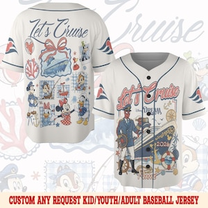 May include: White baseball jersey with navy blue trim and short sleeves. The front features a cruise ship graphic and the text "Let's Cruise". The back has various cartoon characters and the same text. The jersey is a kid/youth/adult size.