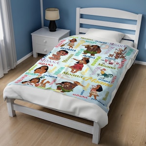 May include: A light blue throw blanket featuring a repeating pattern of characters from the movie Moana, including Moana, Maui, Pua the pig, and Heihei the rooster, interspersed with the word Moana printed in various colorful fonts and styles.