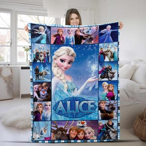 May include: A rectangular fleece blanket featuring a collage of Frozen characters including Elsa, Anna, Kristoff, Sven, and Olaf. The center displays a large image of Elsa with the name ALICE printed in bold blue letters against a snowy background.