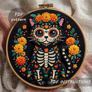 May include: A black cat embroidery in a wooden hoop, featuring a Day of the Dead design. The cat has a skeleton body, floral accents, and the text "PDF pattern" and "PDF instructions". The cat is surrounded by orange and green floral embroidery.
