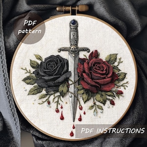 May include: Embroidered hoop art featuring a detailed design of a sword piercing two roses, one black and one deep red. The roses are surrounded by green leaves and small beads. The text "PDF pattern" and "PDF instructions" are visible.