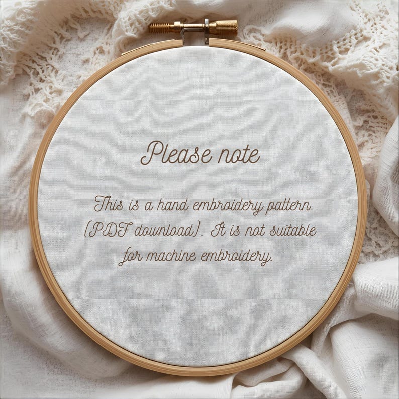 May include: A wooden embroidery hoop holds a white fabric with the text "Please note." The text continues, "This is a hand embroidery pattern (PDF download). It is not suitable for machine embroidery." The hoop is set against a textured, off-white background.
