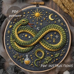 May include: Embroidered hoop art featuring a green and yellow snake in an infinity symbol shape. The design includes a sun, moon, stars, and a potion bottle. The text "PDF pattern" and "PDF instructions" are visible.
