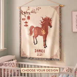 May include: A beige tapestry wall hanging featuring a brown horse illustration, Chinese lanterns, and floral details. The tapestry is inscribed with the name "JAMES" and the year "2026". It has a decorative border.