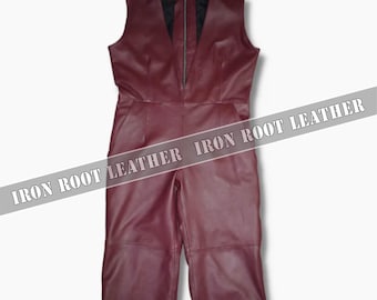 May include: A sleeveless, burgundy leather jumpsuit with a V-neckline and a front zipper. The jumpsuit has a tailored fit and cropped, wide-leg pants. The text "IRON ROOT LEATHER" is printed across the image.