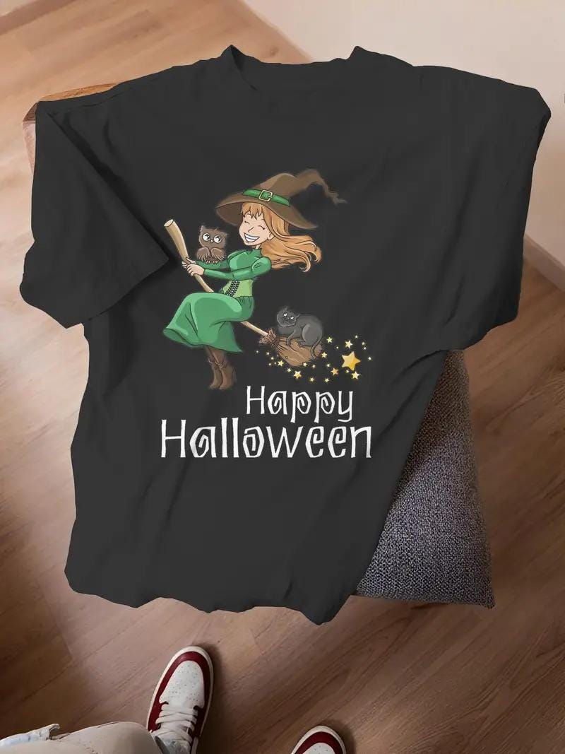 Witch with Owl and Cat Halloween Graphic T-Shirt for Women, Spooky Magician Design with Green Letter
