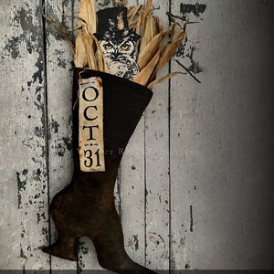 May include: A black witch boot stocking with a brown owl wearing a top hat and a tag that says "OCT 31". The boot is filled with dried corn husks. The boot is 14 inches tall. Witch Boot Stocking & Printable Graphic Accessories.