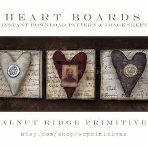 May include: Three heart-shaped decorations on wooden blocks. The hearts are made of fabric and have different textures and embellishments. The blocks are covered in vintage-looking paper with handwritten text.