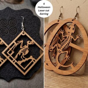 May include: Laser-cut wooden earrings featuring skeleton designs. One pair is diamond-shaped with a bird skeleton, and the other is circular with a lizard skeleton. Both have metal hooks. The text 5 Halloween Laser cut Earring is visible.