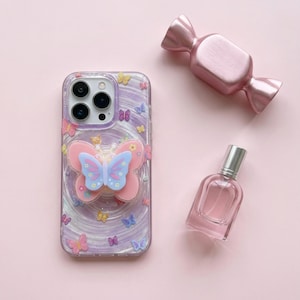 May include: A set of three ceramic mugs with a speckled, matte finish. The mugs are in cream, light grey, and dark grey. Each mug has a simple, minimalist design, ideal for coffee or tea.