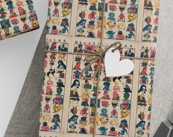 May include: Gift-wrapped presents with decorative paper featuring colorful illustrations, tied with twine and adorned with star and heart-shaped tags. A ball of twine, scissors, and blank tags are also present.