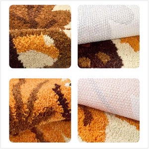 May include: Close-up of a patterned rug with a non-slip backing. The rug features a design in shades of brown, orange, and cream. The texture appears soft and plush, with a detailed view of the fibres and the backing material.