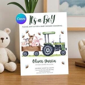 以下が含まれることがあります： 「It's a Boy」の文字が入ったベビーシャワーの招待状。トラクターが農場の動物を乗せたワゴンを引いている水彩画のイラストが特徴です。招待状には「Oliver Garcia」の名前とイベントの詳細が含まれています。