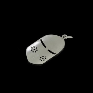 May include: Silver charm in the shape of a knight's helmet with a face mask design. The helmet has a small loop at the top for attaching to a chain or bracelet.