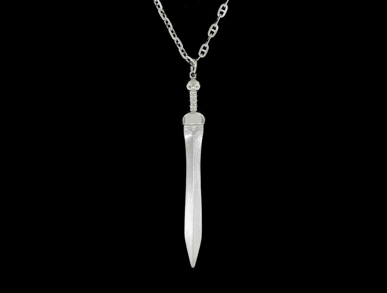 May include: A silver sword pendant necklace with a chain.