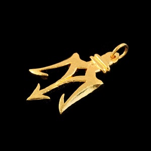 May include: A gold-colored trident pendant charm. The trident is a three-pronged spear, a symbol of power and strength.