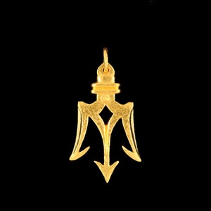 May include: A gold trident pendant with a textured surface. The pendant has a loop at the top for attaching to a chain.