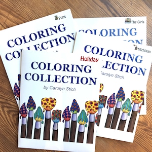 May include: Three coloring books with the title "Coloring Collection" and a paintbrush design. The books are titled "Puns", "Holiday", and "The Girls".