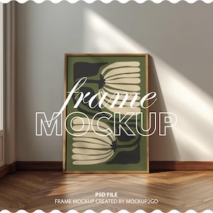 Puede incluir: Una impresión artística enmarcada con un diseño floral en tonos verdes, negros y beige. La obra de arte se muestra en un marco de madera y se apoya contra una pared. El texto "frame MOCKUP" está superpuesto en la imagen.