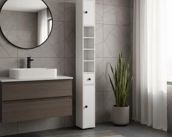 May include: A modern bathroom scene featuring a white storage cabinet with open shelves and a closed door. A round black mirror hangs above a dark wood vanity with a white sink. A tall potted plant stands nearby.